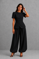 Women’s elegant two piece trouser set with tailored top and ankle-length balloon leg trousers.
