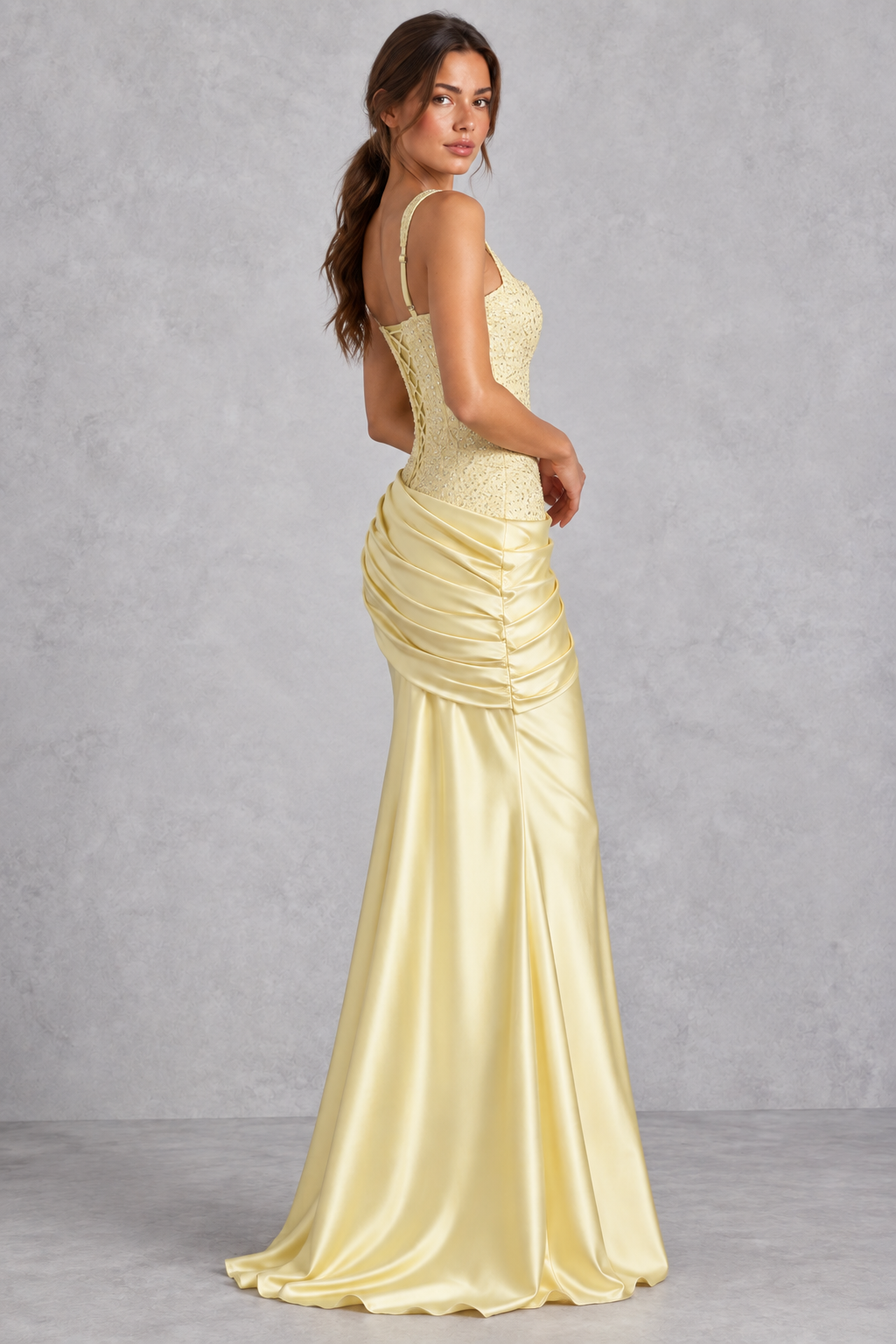 Women’s embellished corset satin maxi dress with square neckline, lace-up back, asymmetric pleated hip draping and flared hem.