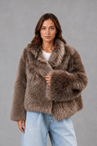 Women’s oversized faux fur coat with a soft plush texture, statement collar and relaxed silhouette for elegant autumn and winter styling.
