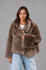 Women’s oversized faux fur coat with a soft plush texture, statement collar and relaxed silhouette for elegant autumn and winter styling.