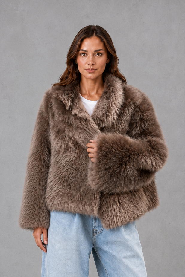 Women’s oversized faux fur coat with a soft plush texture, statement collar and relaxed silhouette for elegant autumn and winter styling.