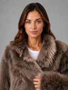 Women’s oversized faux fur coat with a soft plush texture, statement collar and relaxed silhouette for elegant autumn and winter styling.