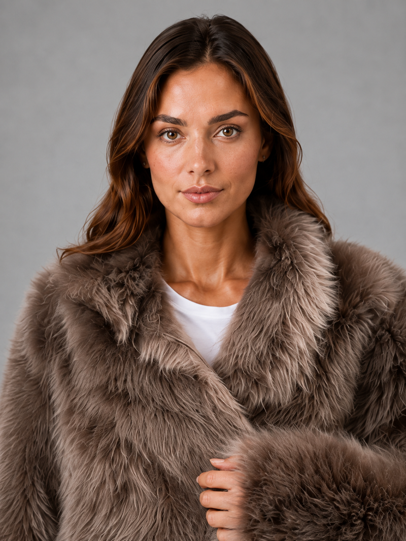 Women’s oversized faux fur coat with a soft plush texture, statement collar and relaxed silhouette for elegant autumn and winter styling.