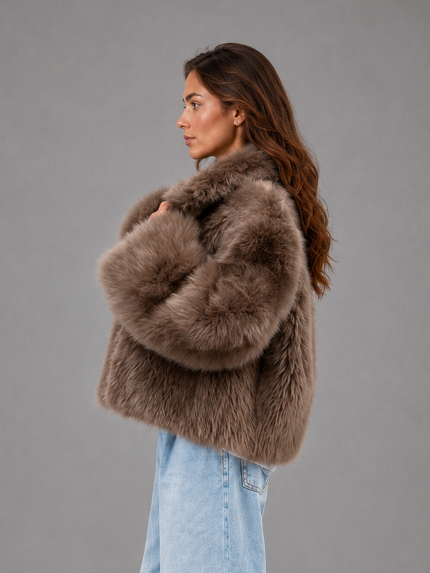Women’s oversized faux fur coat with a soft plush texture, statement collar and relaxed silhouette for elegant autumn and winter styling.