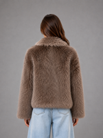 Women’s oversized faux fur coat with a soft plush texture, statement collar and relaxed silhouette for elegant autumn and winter styling.