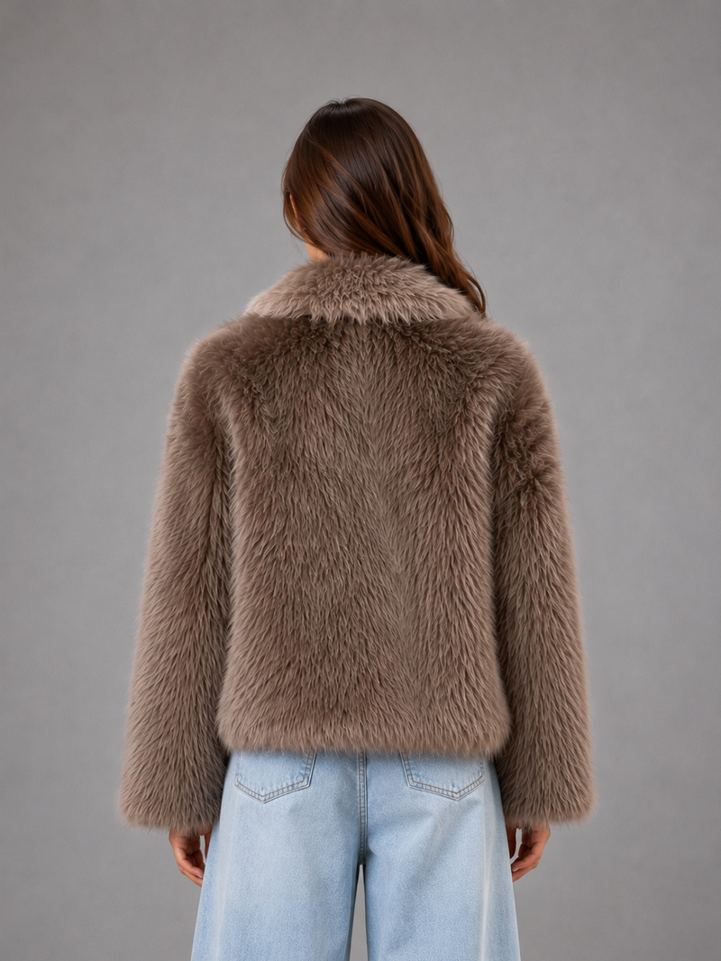 Women’s oversized faux fur coat with a soft plush texture, statement collar and relaxed silhouette for elegant autumn and winter styling.