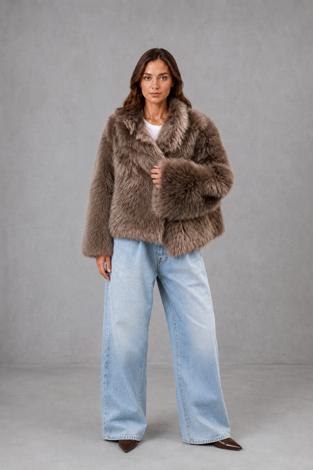 Women’s oversized faux fur coat with a soft plush texture, statement collar and relaxed silhouette for elegant autumn and winter styling.
