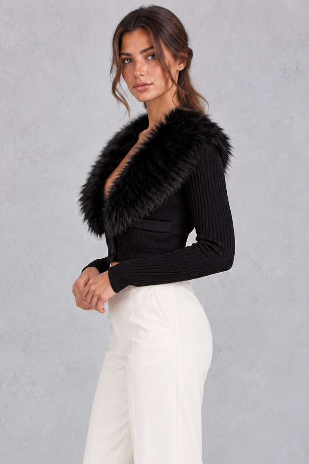 Women’s ribbed knit cardigan with a plush faux fur collar, deep V-neckline, button front and fitted cropped silhouette.