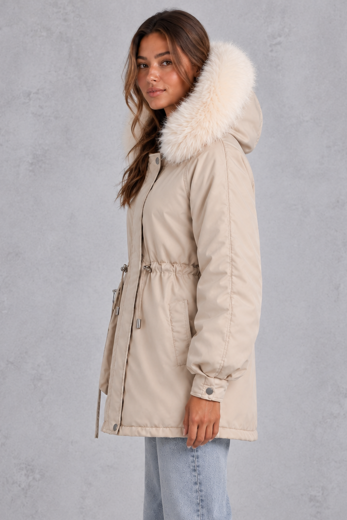 Women’s hooded parka coat with soft faux fur trim, an adjustable drawstring waist, long sleeves and a longer curved hem.