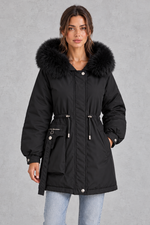 Women’s hooded parka coat with soft faux fur trim, an adjustable drawstring waist, long sleeves and a longer curved hem.