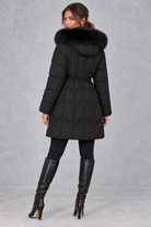 Women’s padded puffer parka with a plush faux fur-trimmed hood, adjustable drawstring waist, long sleeves and practical front pockets.