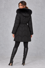 Women’s padded puffer parka with a plush faux fur-trimmed hood, adjustable drawstring waist, long sleeves and practical front pockets.