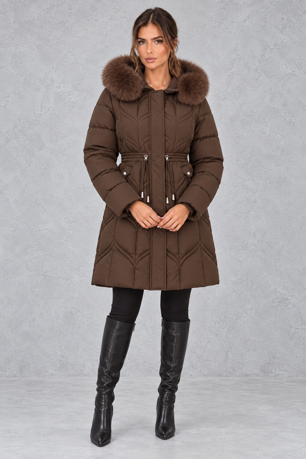 Women’s padded puffer parka with a plush faux fur-trimmed hood, adjustable drawstring waist, long sleeves and practical front pockets.