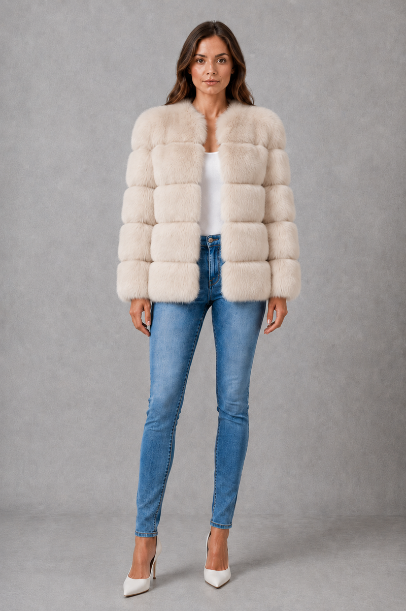 Women’s plush faux fur jacket with an elegant statement collar, relaxed silhouette and soft textured finish for autumn and winter styling.