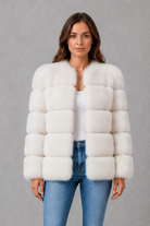 Women’s plush faux fur jacket with an elegant statement collar, relaxed silhouette and soft textured finish for autumn and winter styling.
