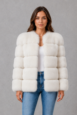 Women’s plush faux fur jacket with an elegant statement collar, relaxed silhouette and soft textured finish for autumn and winter styling.