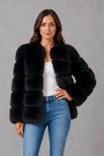Women’s plush faux fur jacket with an elegant statement collar, relaxed silhouette and soft textured finish for autumn and winter styling.