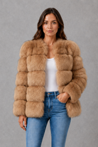 Women’s plush faux fur jacket with an elegant statement collar, relaxed silhouette and soft textured finish for autumn and winter styling.