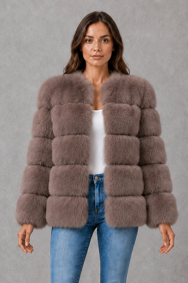 Women’s plush faux fur jacket with an elegant statement collar, relaxed silhouette and soft textured finish for autumn and winter styling.