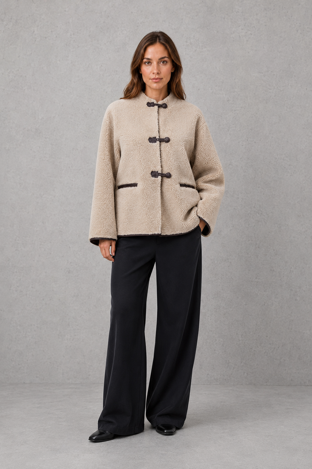 Women’s oversized faux fur toggle jacket with contrast trim, front pockets and a warm textured finish