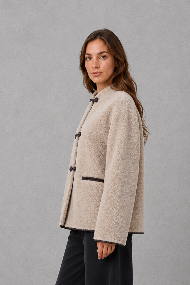 Women’s oversized faux fur toggle jacket with contrast trim, front pockets and a warm textured finish