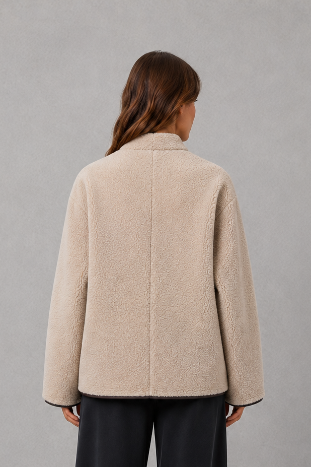 Women’s oversized faux fur toggle jacket with contrast trim, front pockets and a warm textured finish