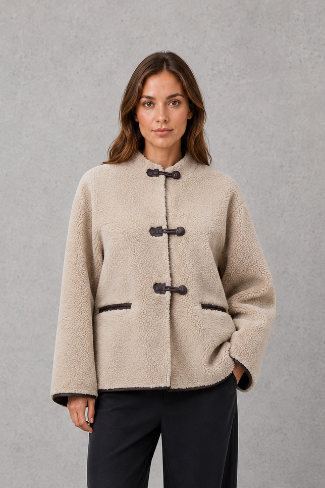 Women’s oversized faux fur toggle jacket with contrast trim, front pockets and a warm textured finish