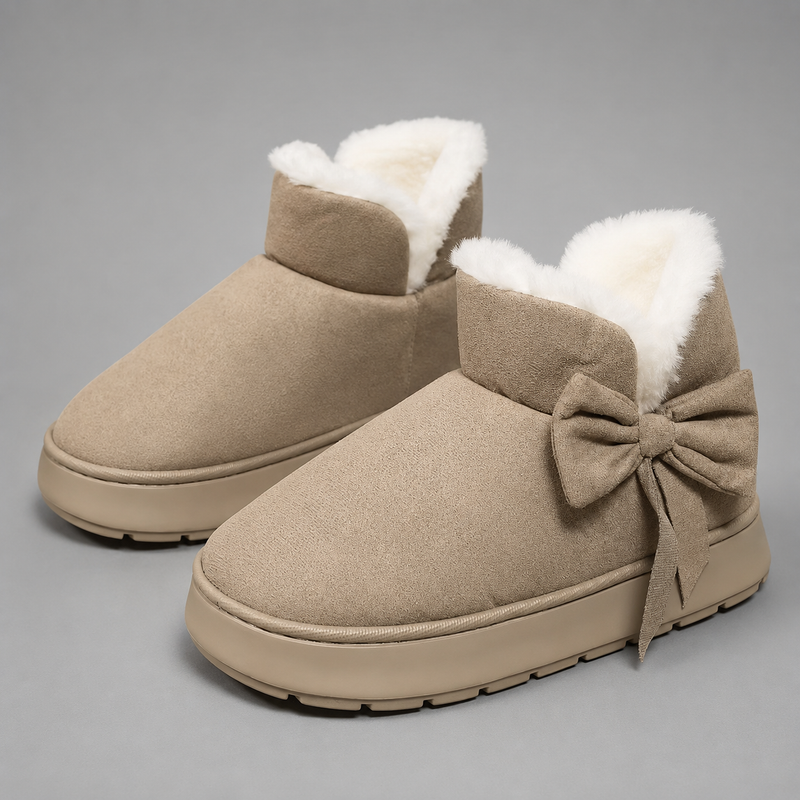 Women's faux suede winter boot slippers with plush fleece lining, side bow detail, cushioned platform sole and non-slip outsole, designed for warm, comfortable indoor wear and light outdoor use during autumn and winter.