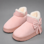Women's faux suede winter boot slippers with plush fleece lining, side bow detail, cushioned platform sole and non-slip outsole, designed for warm, comfortable indoor wear and light outdoor use during autumn and winter.