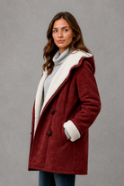 Women’s fleece-lined winter coat with a soft cosy interior, flattering feminine silhouette and elegant design for everyday cold-weather wear.