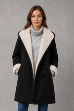Women’s fleece-lined winter coat with a soft cosy interior, flattering feminine silhouette and elegant design for everyday cold-weather wear.