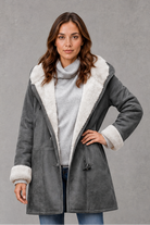 Women’s fleece-lined winter coat with a soft cosy interior, flattering feminine silhouette and elegant design for everyday cold-weather wear.