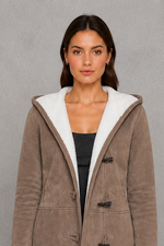 Women’s fleece-lined toggle coat with hood, designed for warm and cosy autumn and winter wear.