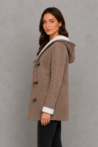 Women’s fleece-lined toggle coat with hood, designed for warm and cosy autumn and winter wear.