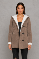 Women’s fleece-lined toggle coat with hood, designed for warm and cosy autumn and winter wear.