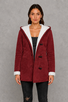 Women’s fleece-lined toggle coat with hood, designed for warm and cosy autumn and winter wear.