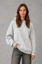 Women’s relaxed-fit fleece hoodie in a soft cotton and recycled polyester blend with long sleeves, ribbed cuffs and hem.