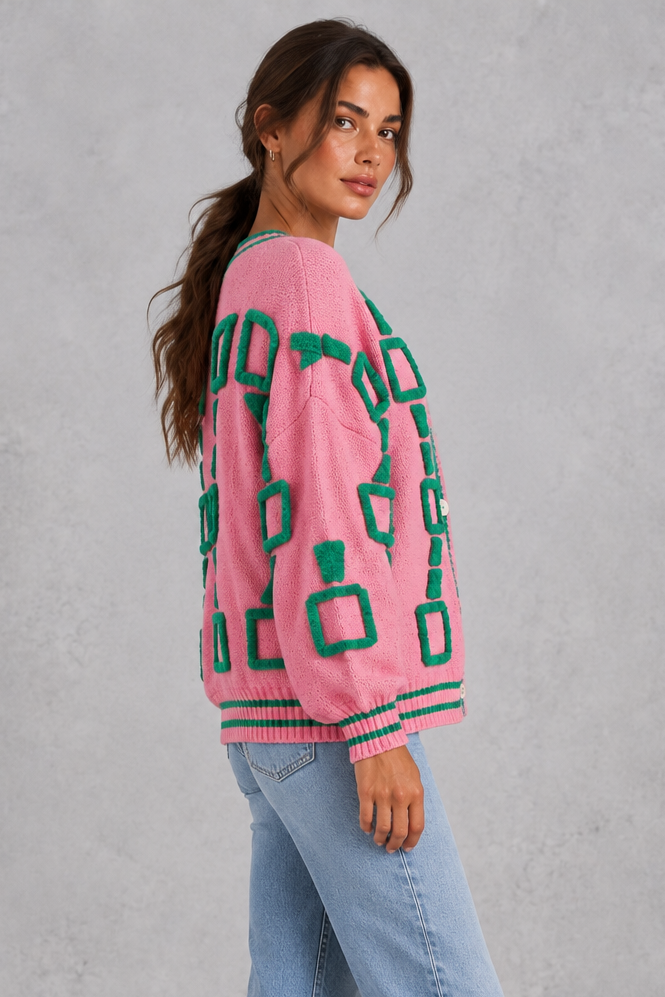 Women’s geometric knit cardigan with a deep V-neckline, button front, dropped shoulders and contrast striped ribbed trims.