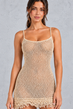 Women’s gold sheer knit mini dress with a square neckline, thin adjustable straps, stretch construction and distinctive frayed hem.