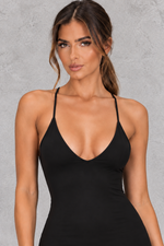 Women’s halter backless bodycon maxi dress with delicate spaghetti straps, gold ring detailing and a sleek fitted silhouette.