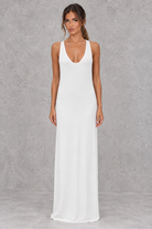 Women’s halter backless bodycon maxi dress with delicate spaghetti straps, gold ring detailing and a sleek fitted silhouette.