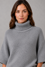 Women’s high neck batwing knit jumper with textured waist-cinching design for autumn and winter.