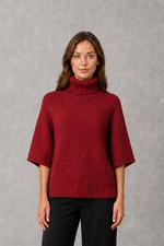 Women’s high neck batwing knit jumper with textured waist-cinching design for autumn and winter.