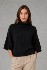 Women’s high neck batwing knit jumper with textured waist-cinching design for autumn and winter.