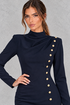 Women’s high neck bodycon mini dress with long sleeves, draped side detailing and statement gold-tone buttons.