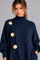 Women's navy blue knitted turtleneck jumper – close-up of gold-tone buttons and wrap front