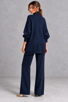 Women's navy blue knitted turtleneck jumper and wide leg trouser set – back view
