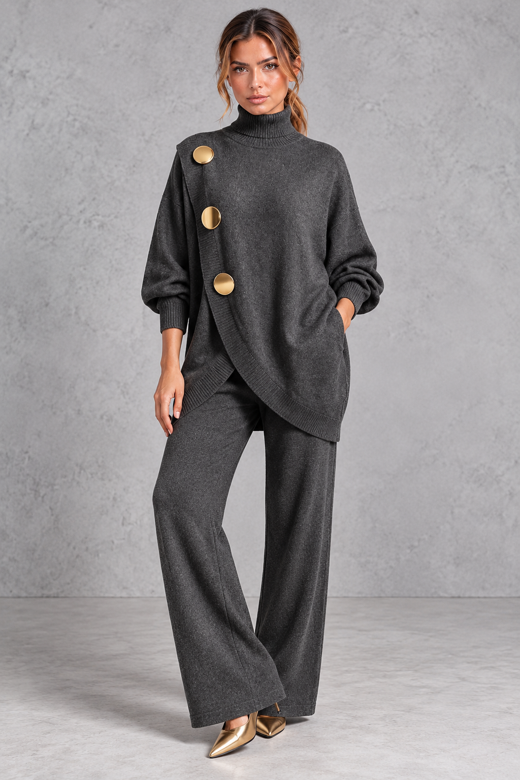 Women's dark grey knitted turtleneck jumper and wide leg trouser set with gold buttons – front view