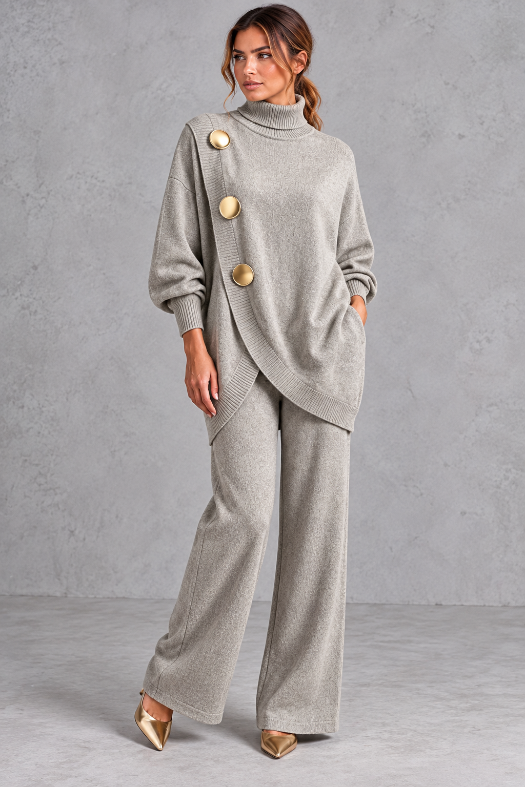 Women's light grey knitted turtleneck jumper and wide leg trouser set with gold buttons – front view