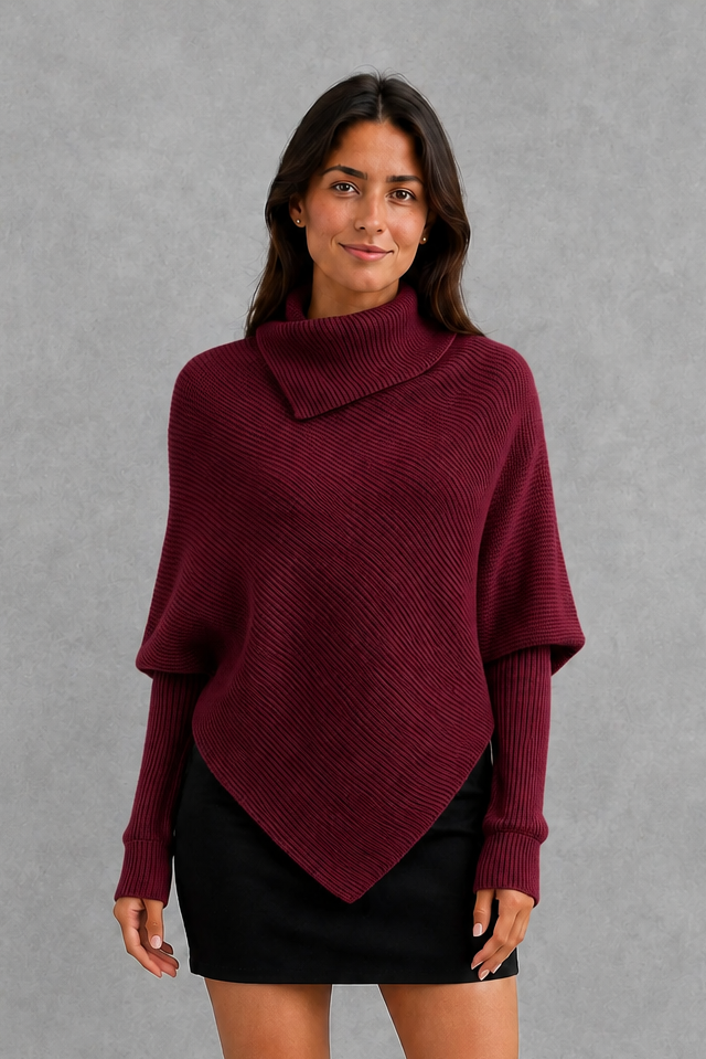 Women’s high neck knit jumper with oversized batwing sleeves, rib-knit texture and an asymmetric split hem.